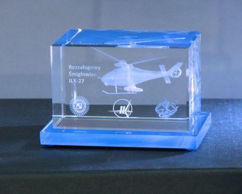 helicopter miniature in crystal glass on a painted base.