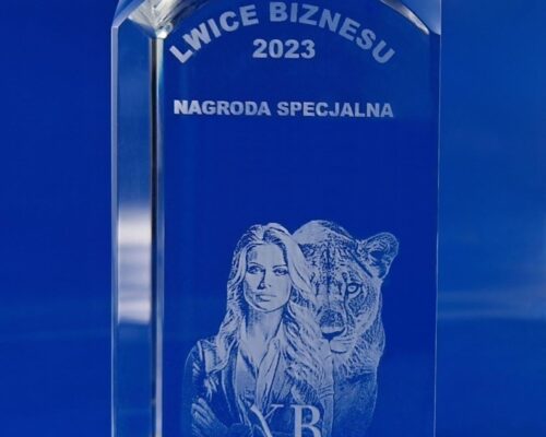glass award of Business Lionesses, a photo of an elegant woman next to a lioness, 3D laser engraved. Statuettes personalized with the competition logo. Prestigious glass award of the European Business Women's Club
