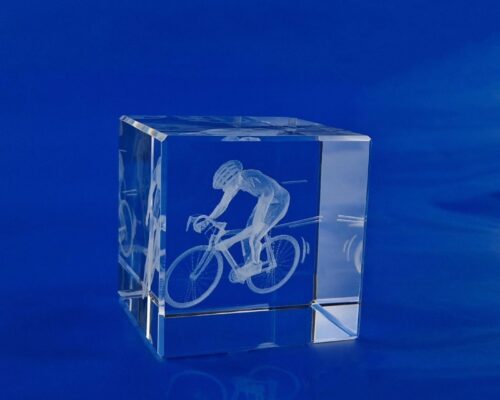 a bicyclist in 3D glass award as a prize in cycling races A crystal with a bicyclist in 3D as a souvenir for the competitors who took part in the race 3D bicyclist figurine for racing, glass cycling trophy 3D bicycle in glass with a dedication