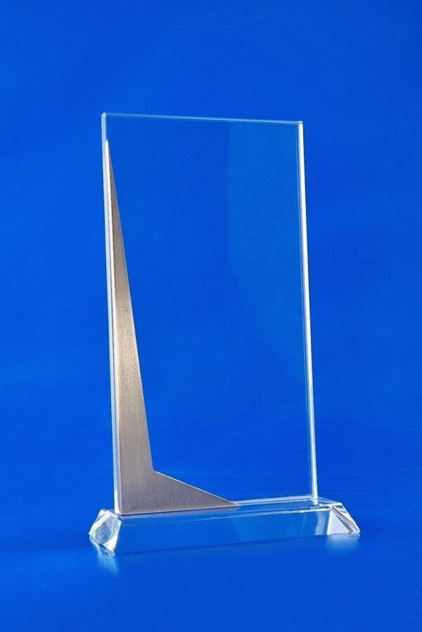 glass award with metal engraving inside the glass Glass statuette with steel on a stylish trapezoidal base