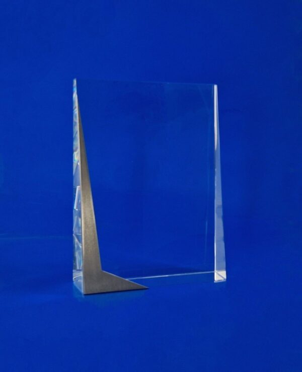 Glass award with a metal plate with 3D engraving, the unusual shape of the steel on the side draws the eye to the crystal statuette CGW crystal award slightly narrow towards the top, perfect for large text and several logos.