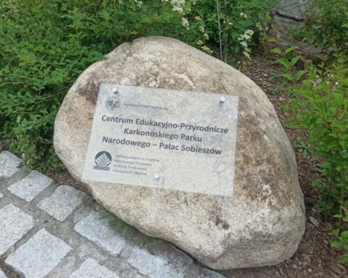 glass board commemorative for the Nature and Education Center Karkonosze National Park A glass commemorative plaque placed on a stone, located in the Palace in Sobieszow