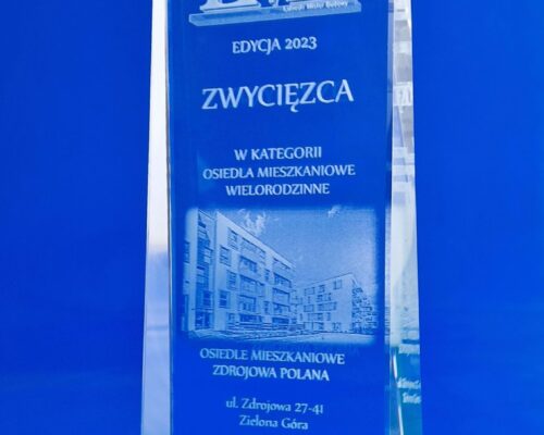 glass award for the winner of the Lubuski Mister Budowy competition. The organizer presenting the glass awards is the Lubuska Chamber of Construction Elegant, crystal statuette, slightly tapering towards the top The decorative green stripe at the bottom and bottom of the award symbolizes the innovativeness of the buildings and is also a reference to the colors of the Lubuskie Voivodeship a photo of the awarded building is engraved with a 3D laser inside the glass the competition logo and inscriptions made using the 3D engraving technique in glass Create original glass awards for your competition with us Statuettes and awards manufacturer – Laser 3D Zielona Gora, Poland